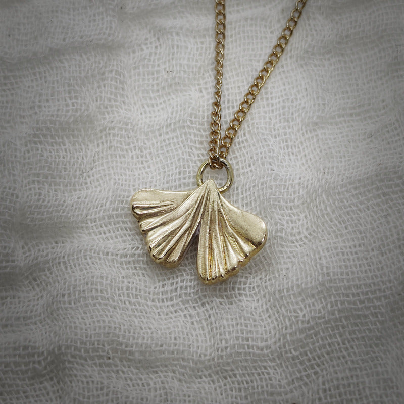gingko biloba pendant in gold