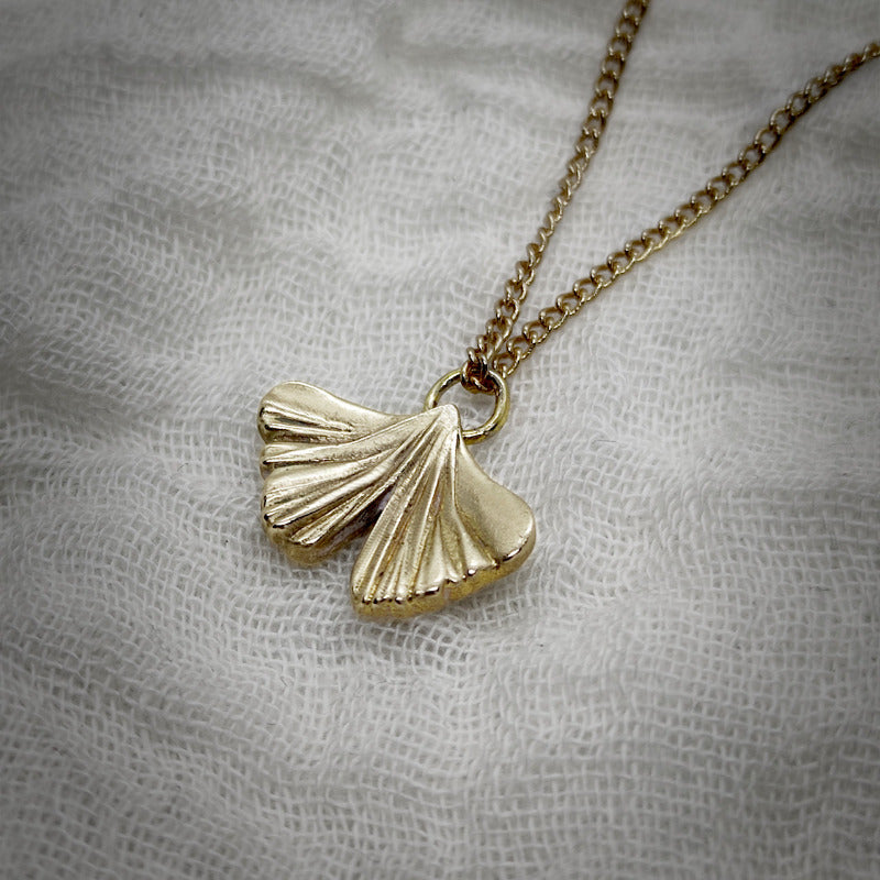 gingko biloba pendant in gold