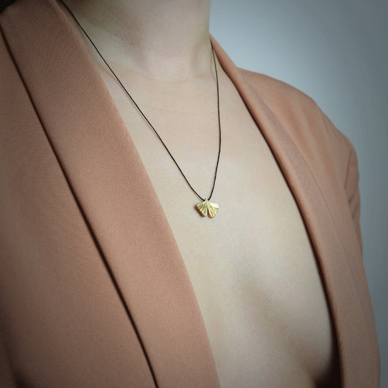 gingko biloba pendant in gold