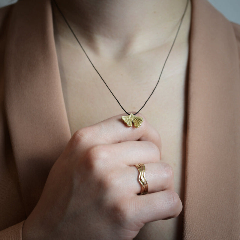 gingko biloba pendant in gold